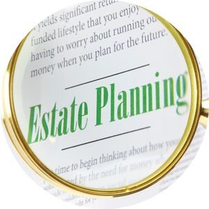 magnifying Glass with Green Estate Planning Text