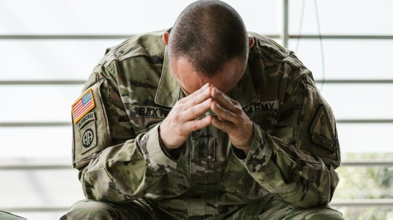 Veteran Sitting with Head in His Hands