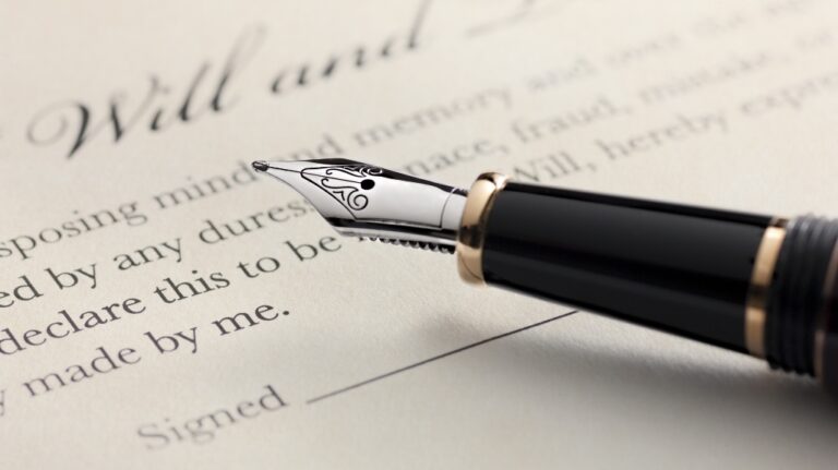 person in Louisiana about to sign the will with a pen