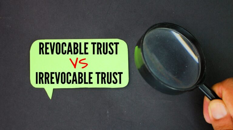 magnifying glass and colored paper with the words Irrevocable Trust vs Revocable Trust