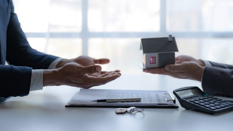 lawyer is giving a model of house to the client