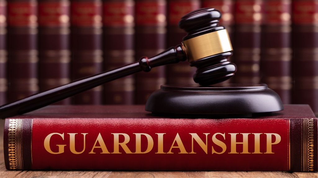 Judge gavel and striking block over law book with Guardianship text