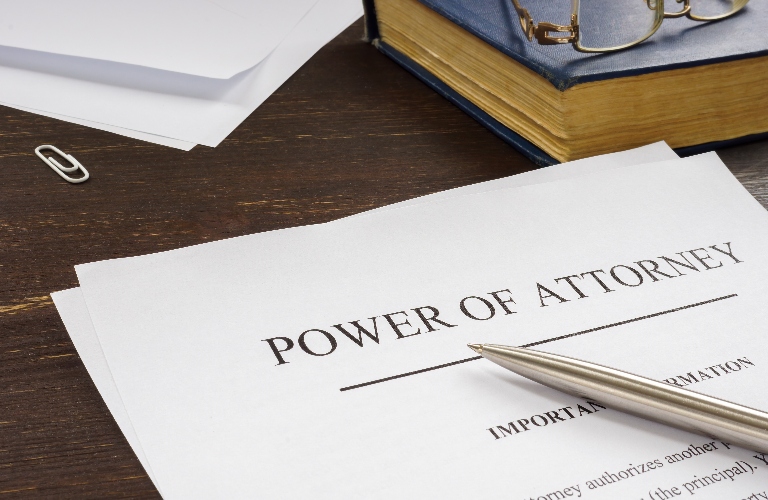 power of attorney document and pen