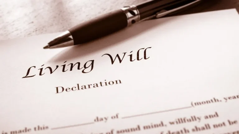 Close-up of a living will declaration document with a black pen resting on top.